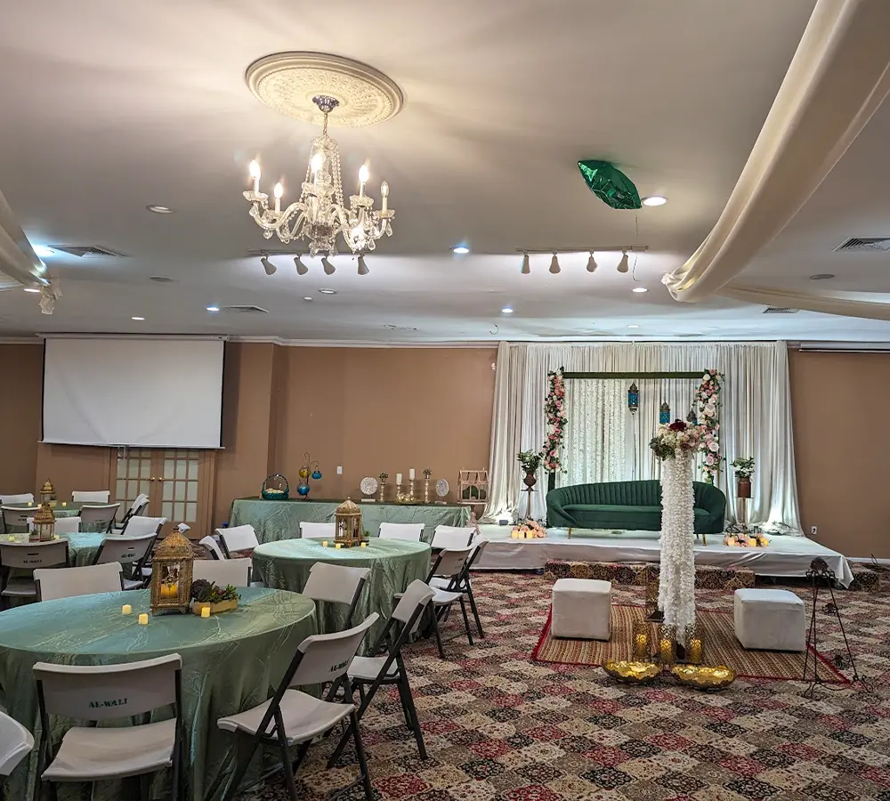 Luxurious banquet setup with maroon and white decor for awards gala and fundraiser.